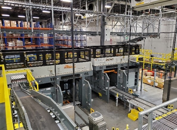 Automated sorting facility showcasing conveyor belts and sorting machinery, designed for efficient package handling and logistics operations.